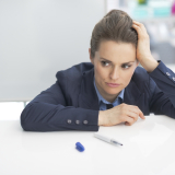 stressed business woman near flipchart